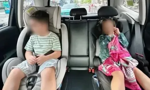 Người lớn ngồi ghế phụ ô tô có được ôm trẻ em ngồi cùng không? Cục CSGT giải đáp