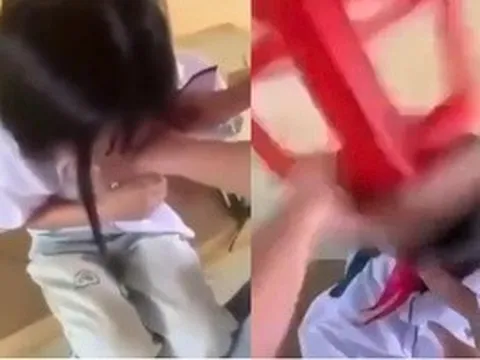 Nữ sinh lớp 8 bị bạn dùng ghế đánh vào đầu, cởi áo giữa lớp
